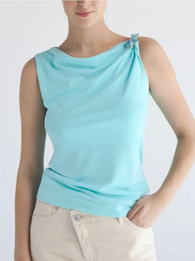 Blusa con applicazione decorativa Colore acqua