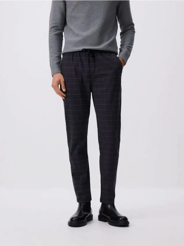 Pantaloni slim fit a quadri Colore blu scuro