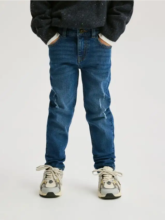 Jeans slim fit strappati Colore blu