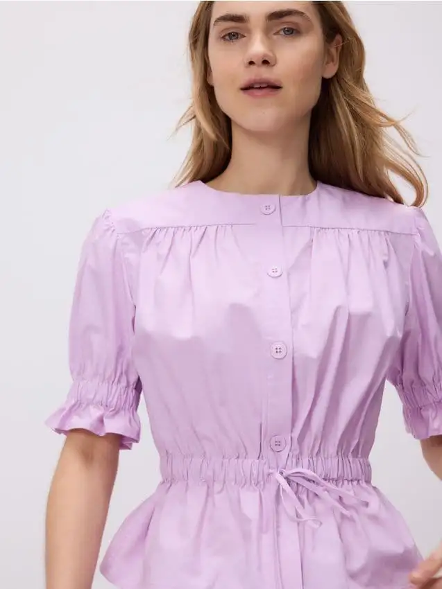 Blusa con base svasata Colore rosa shocking