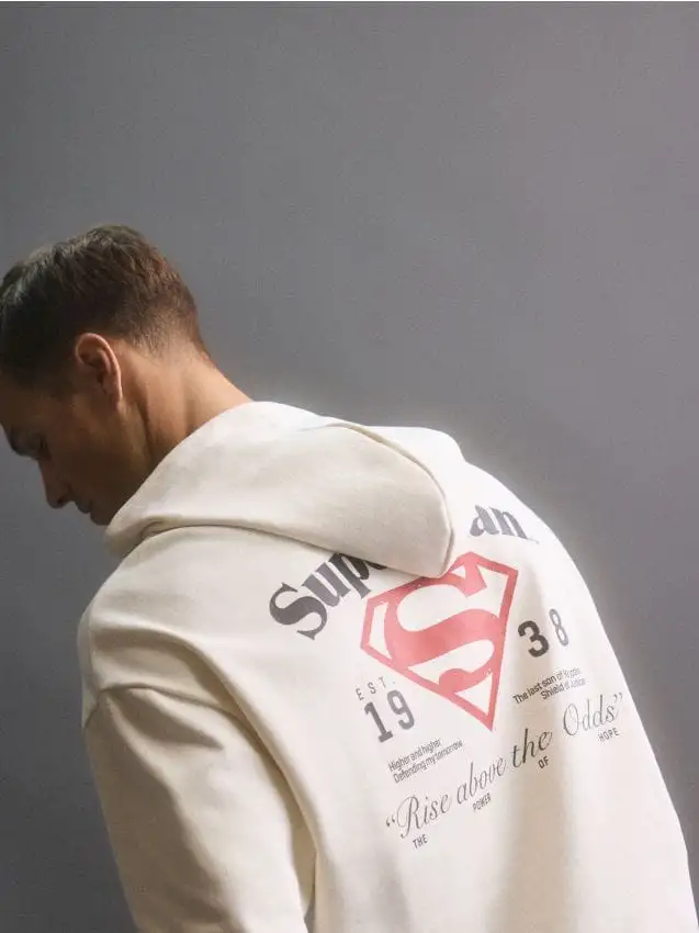 Puuvillane kapuutsiga pusa SUPERMAN™ Colore panna