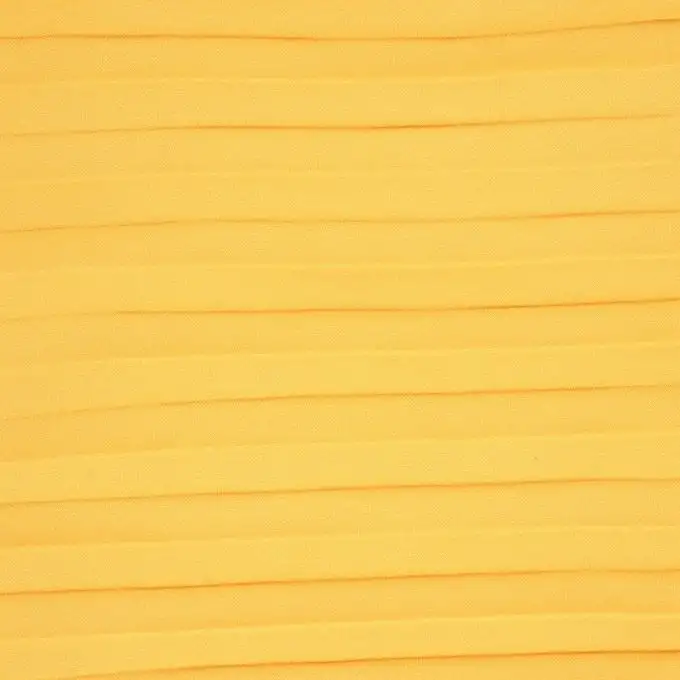 Tessuto crêpe plissettato giallo senape