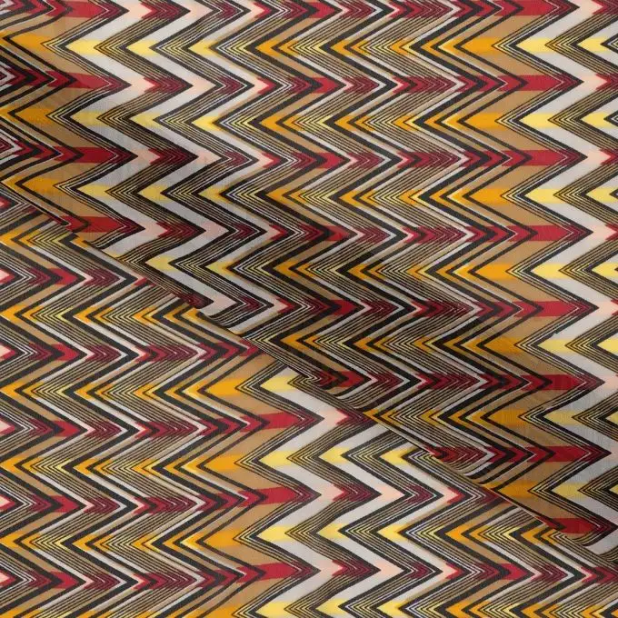 Tessuto mussola zigzag giallo rosso