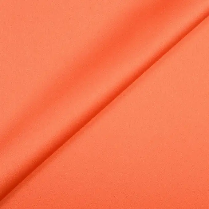 Tessuto in poliestere satinato unito corallo
