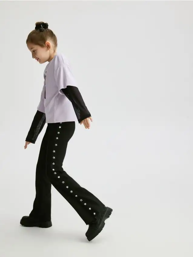 Pantaloni con applicazione Colore nero