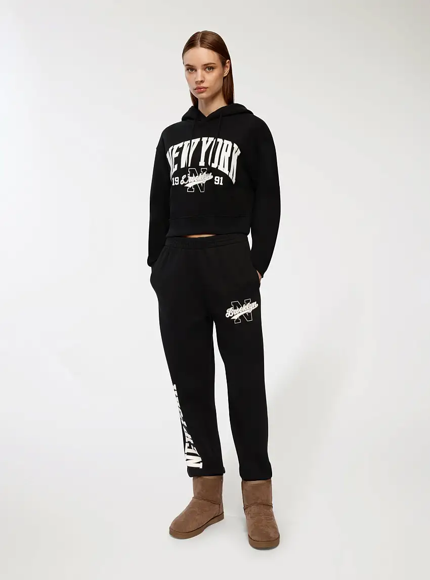 Pantaloni tuta con scritta college Nero