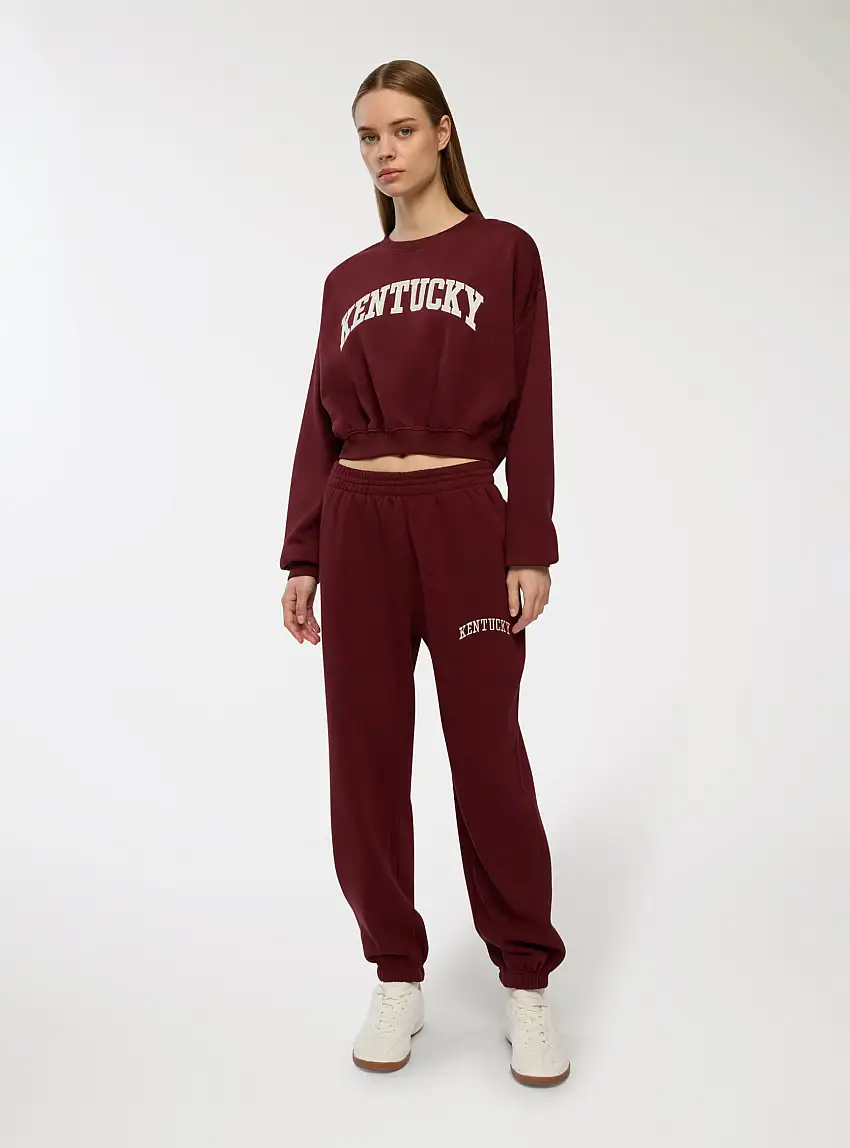 Pantaloni tuta con scritta ricamata Bordeaux