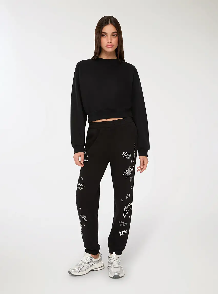 Pantaloni tuta con stampe graffiti Nero