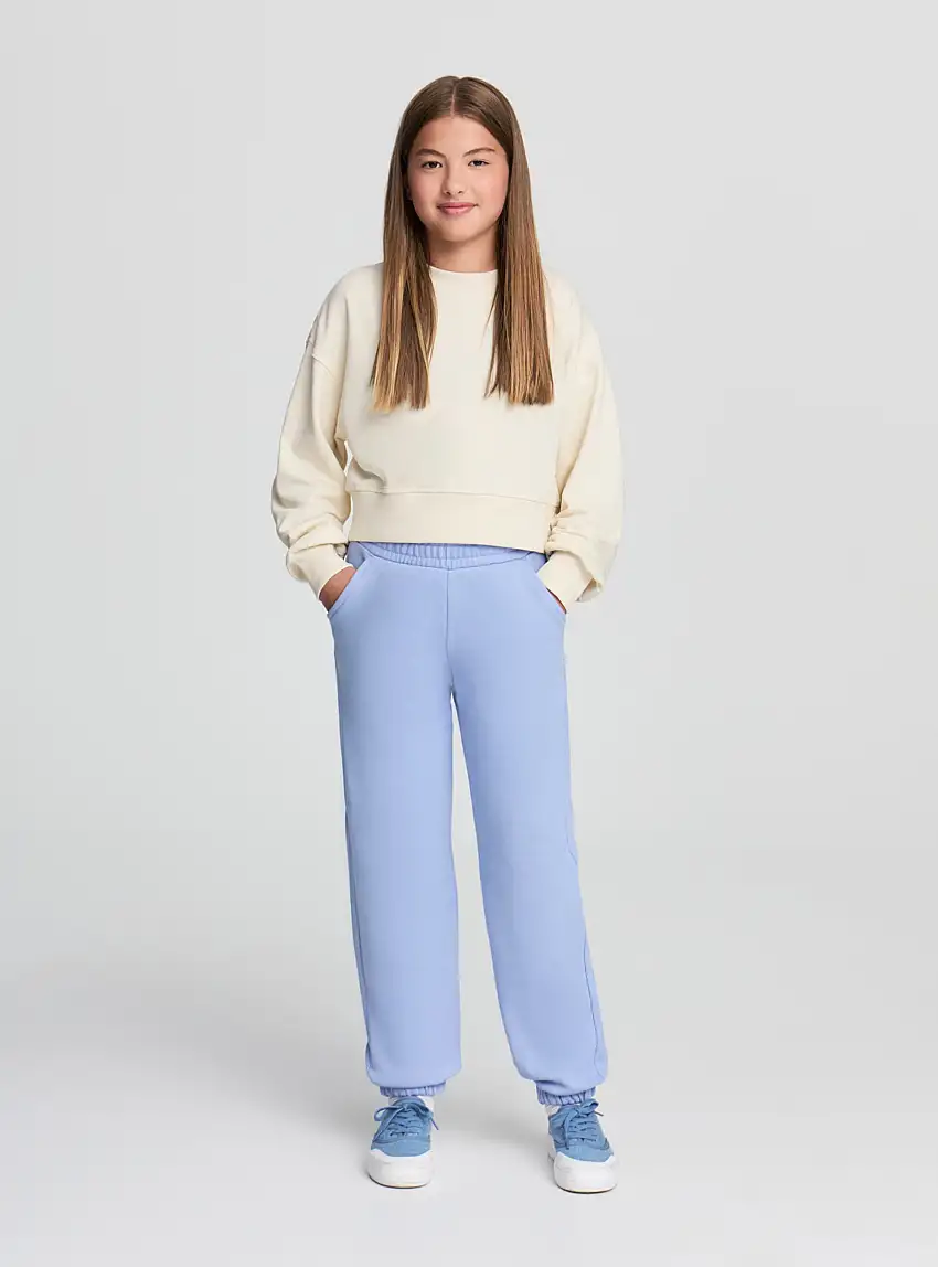 Pantaloni tuta tinta unita con polsini Celeste