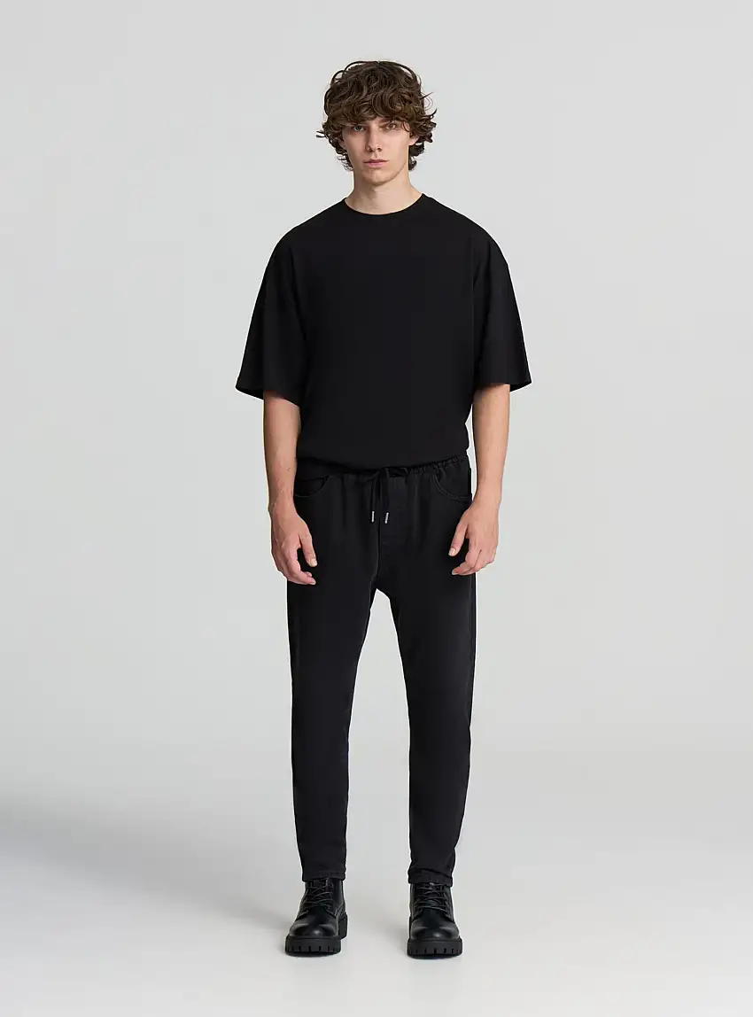 Pantalone in denim con elastico in vita Nero