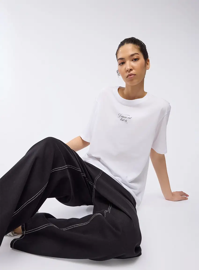 T-shirt ampia con scritta e stampa ali Bianco ottico