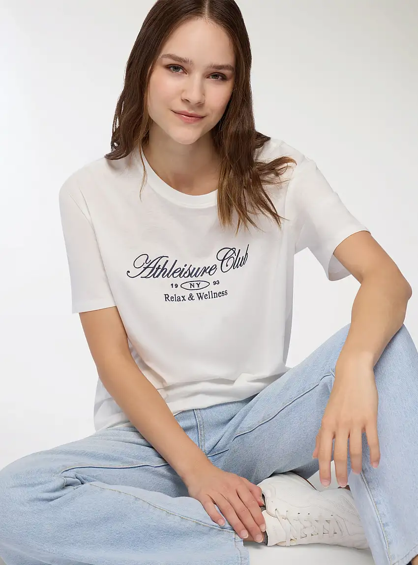 T-shirt ampia con scritta Bianco lana