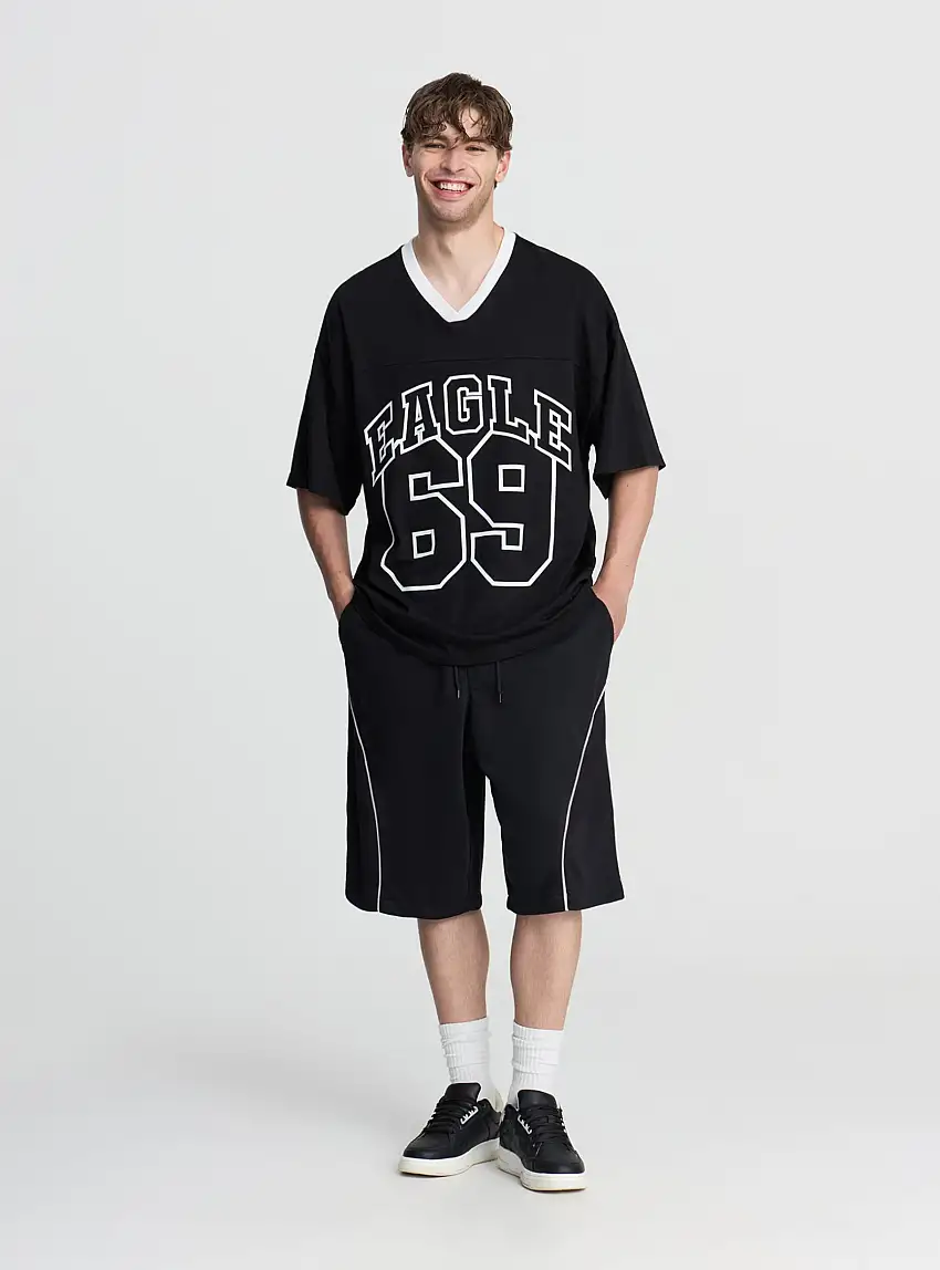 Pantaloncini tuta baggy con piping Nero