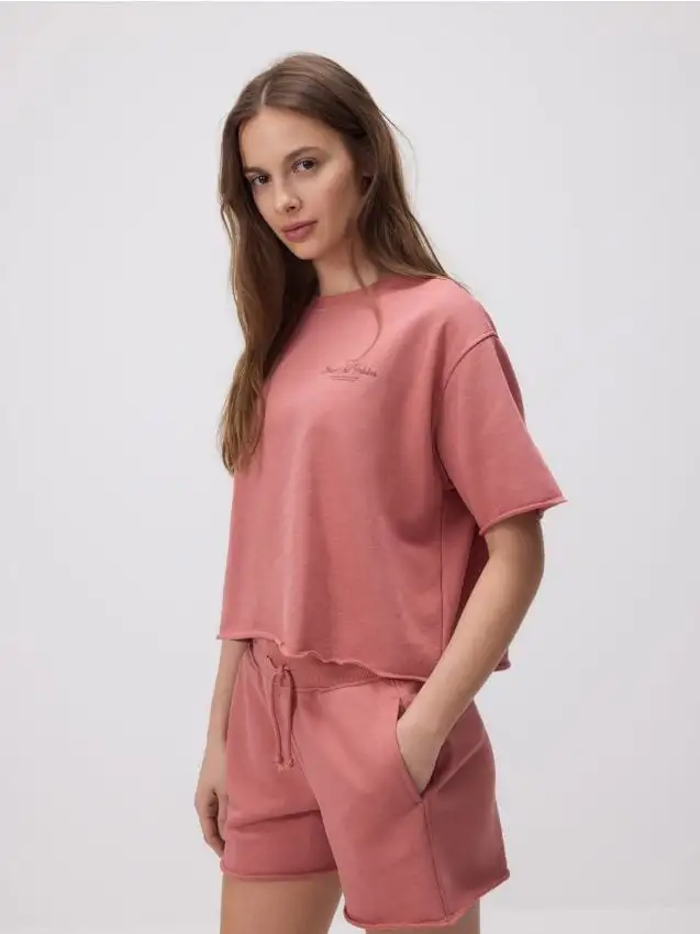 Pantaloncini di felpa Colore arancione chiaro