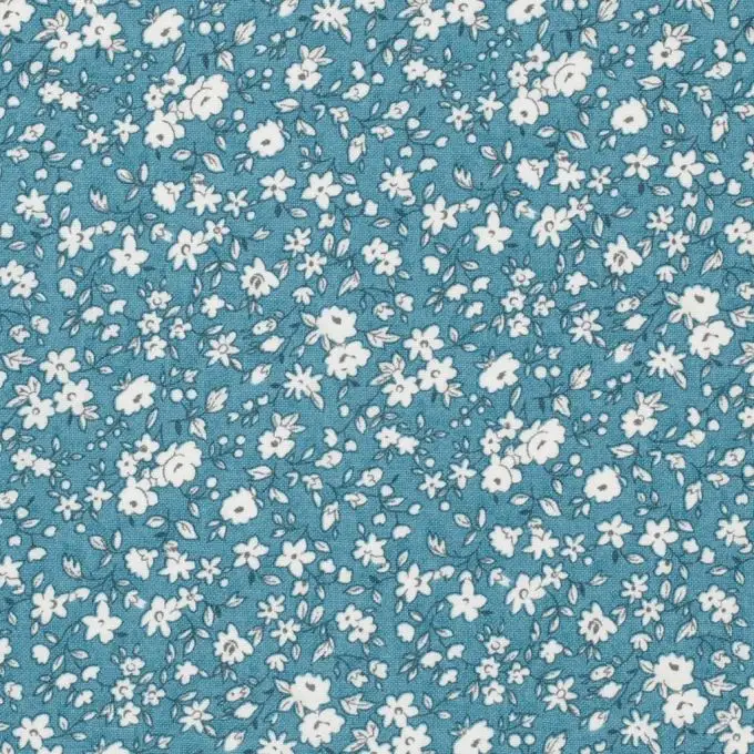 Tessuto cotone piccole fiori bianchi su sfondo blu Léonie