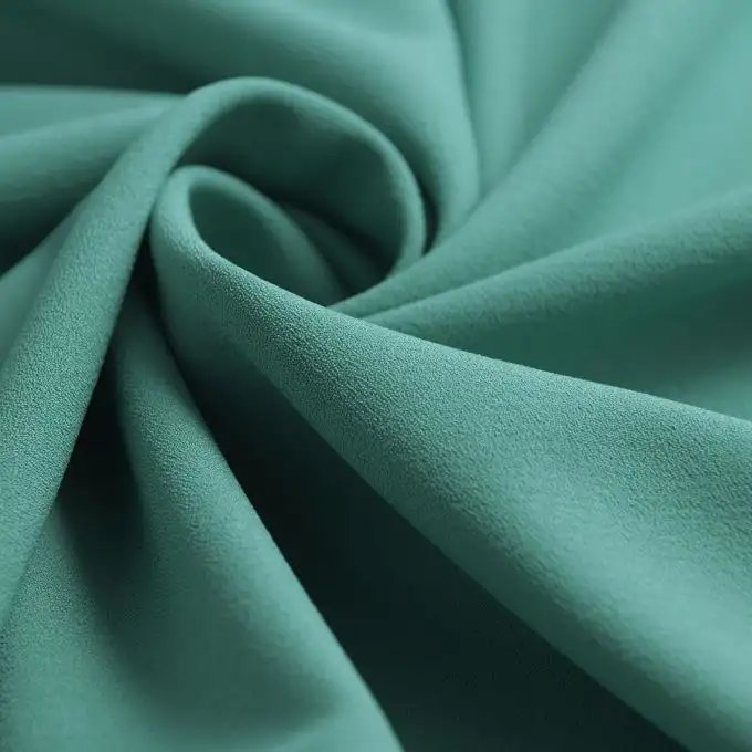 Tessuto crêpe verde tinta unita