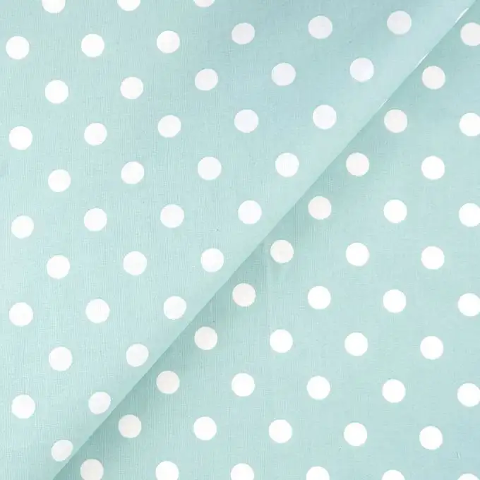 Tessuto cretonne rivestito verde menta pois bianco