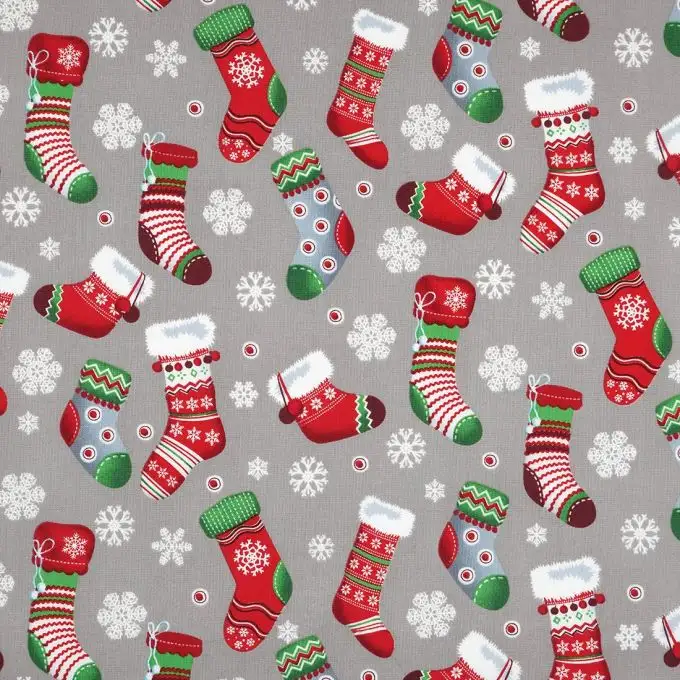 Tessuto natalizio cotone grigio stivali e fiocchi