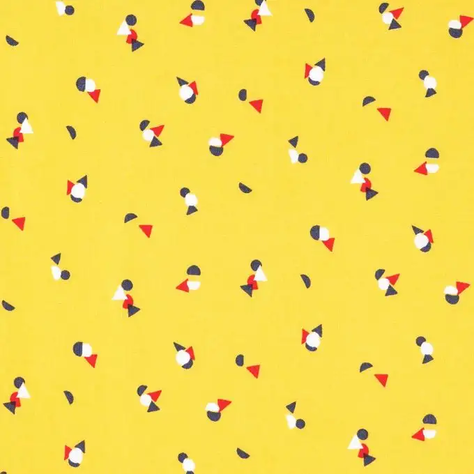 Popeline di cotone giallo tondo triangoli