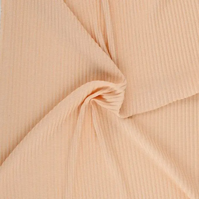 Tessuto jersey plissettato rosa nude