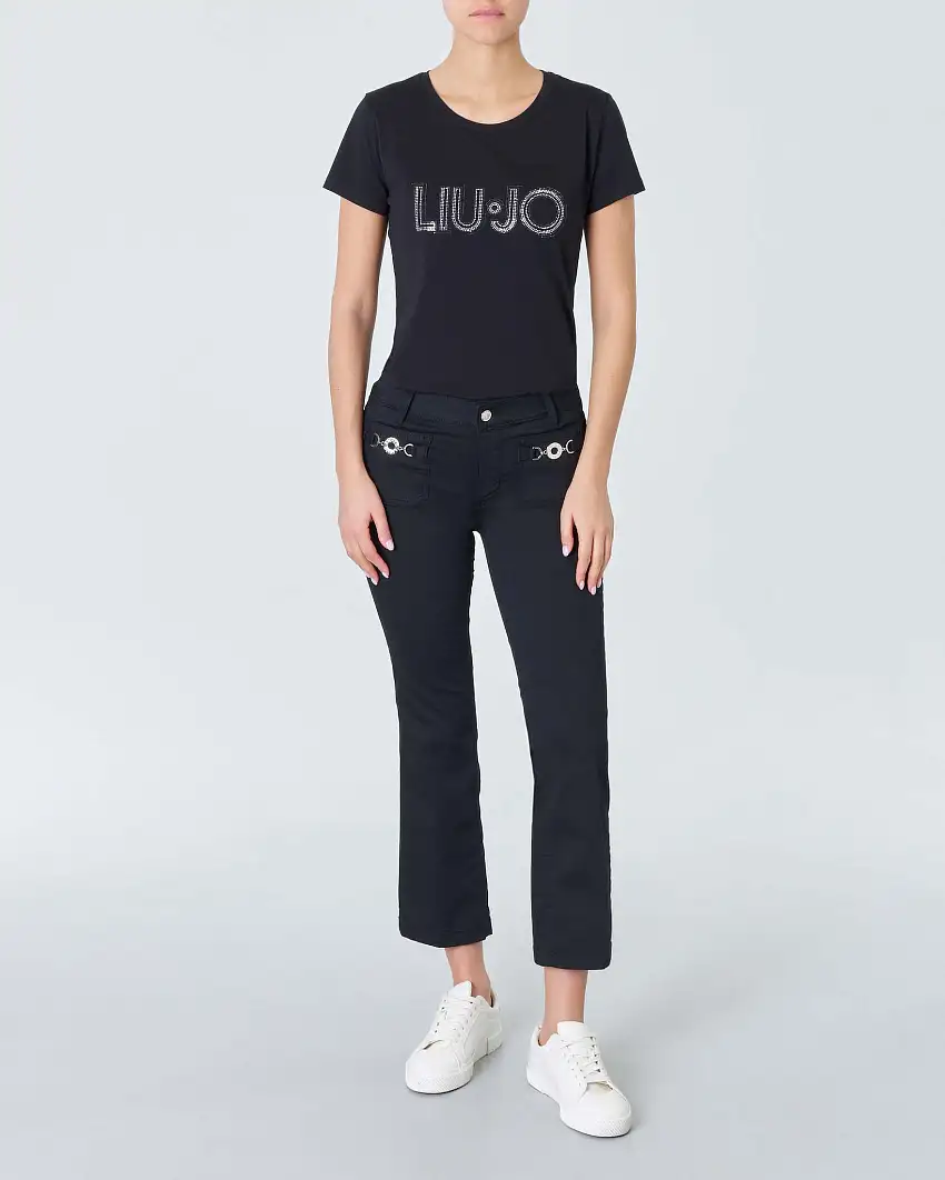 Pantaloni neri a trombetta in bull di cotone stretch con tasche applicate sul davanti