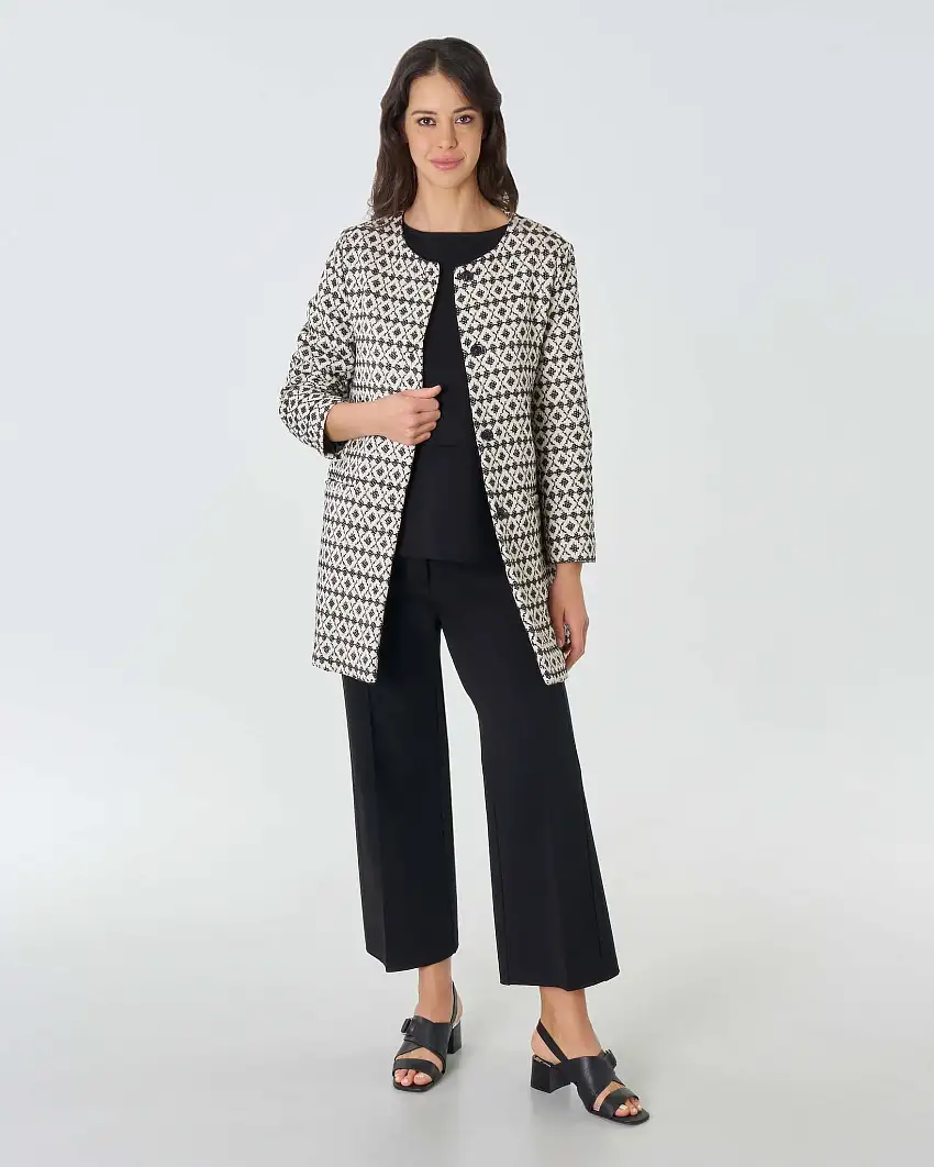 Spolverino color avorio in misto cotone a motivo jacquard nero con scollo tondo