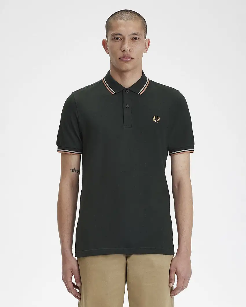 Polo mezza manica verde scuro con bordino rosa e panna