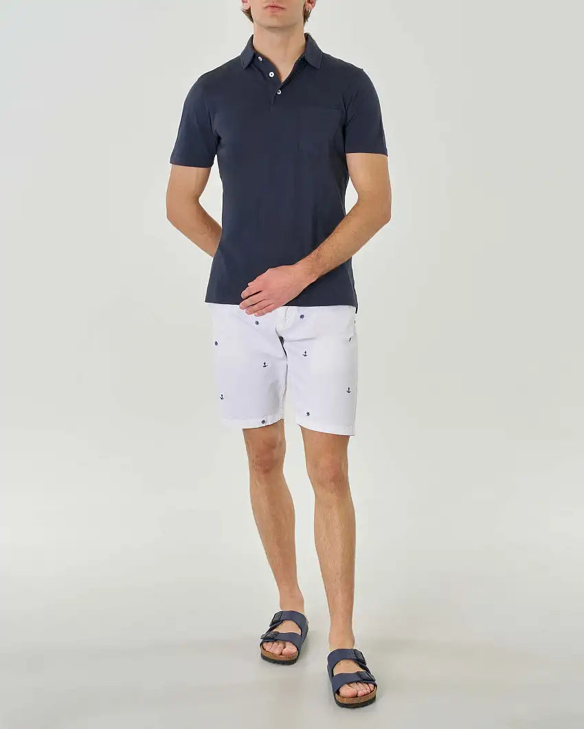 Polo blu mezza manica in cotone fiammato con taschino al petto