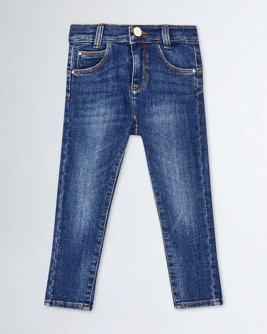 Jeans slim a vita alta in cotone stretch lavaggio medio stone washed con schiariture