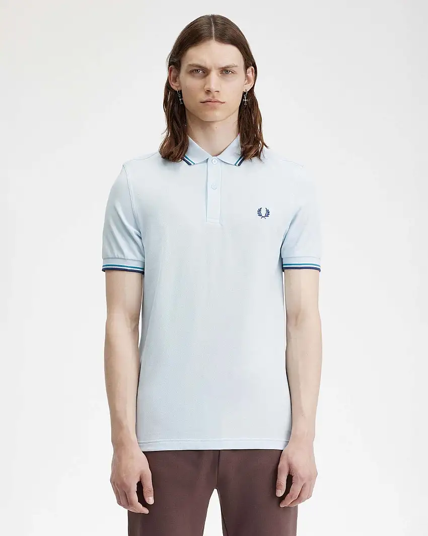 Polo mezza manica azzurra con bordino ottanio e blu indaco