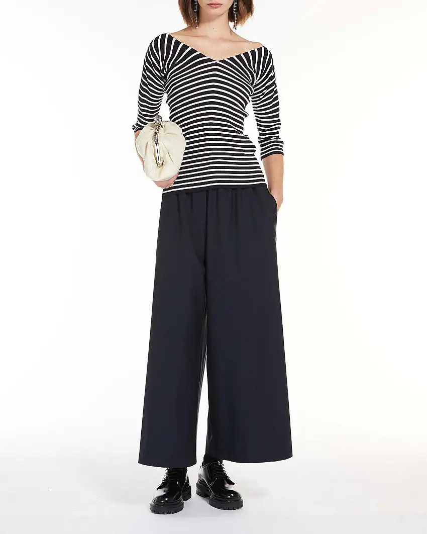 Pantaloni blu dalla linea ampia in maglia di pura lana con elastico e coulisse inseriti in vita