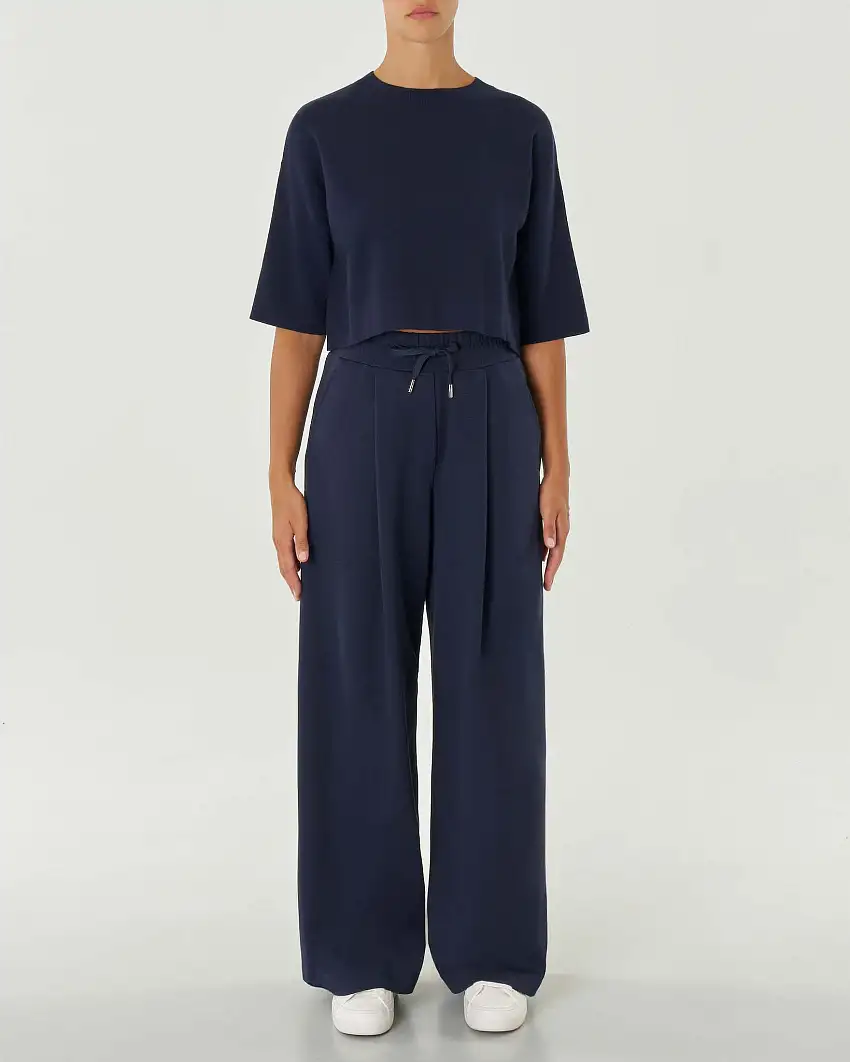 Pantaloni palazzo blu in jersey punto Milano con pieghe profonde frontali e coulisse in vita