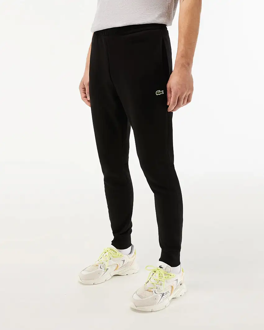 Pantaloni Lacoste neri in felpa di cotone con logo coccodrillo verde sul fianco