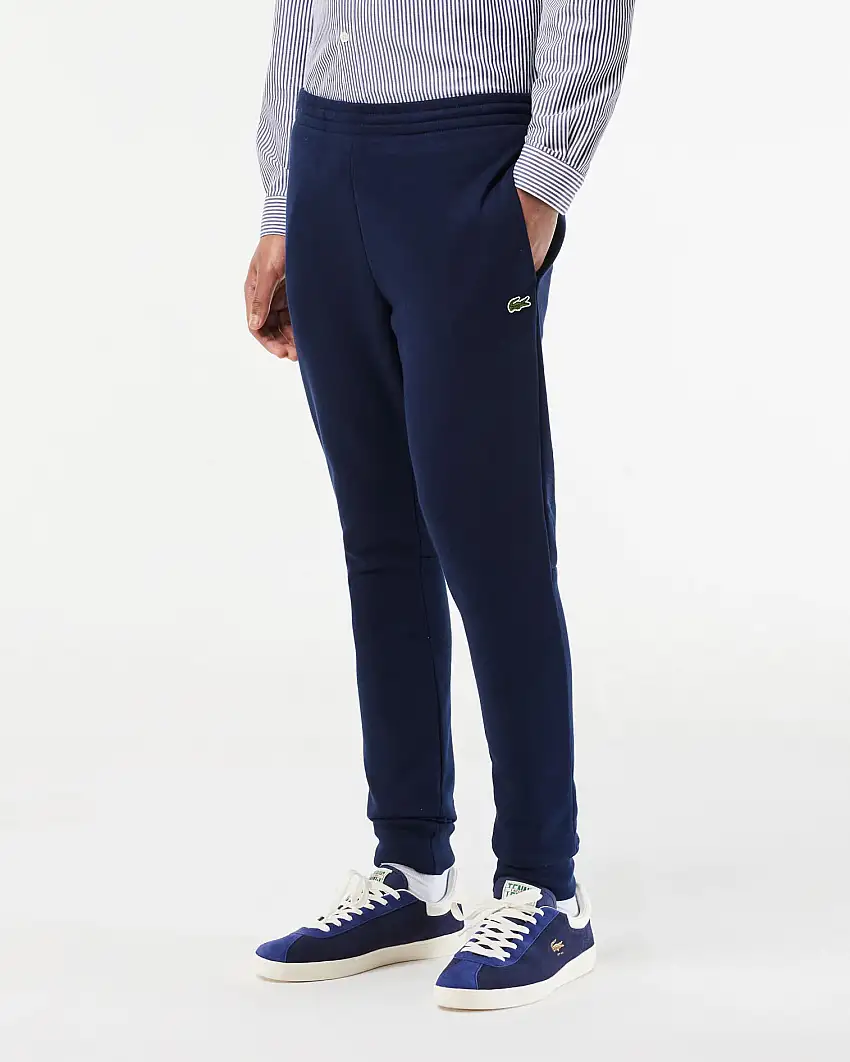 Pantaloni Lacoste blu in felpa di cotone con logo coccodrillo verde sul fianco