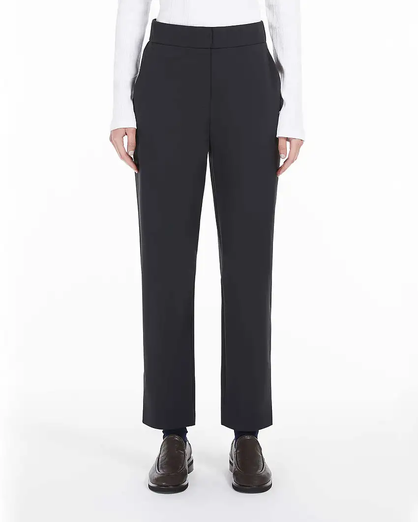 Pantaloni blu slim in jersey tecnico stretch con elastico inserito in vita