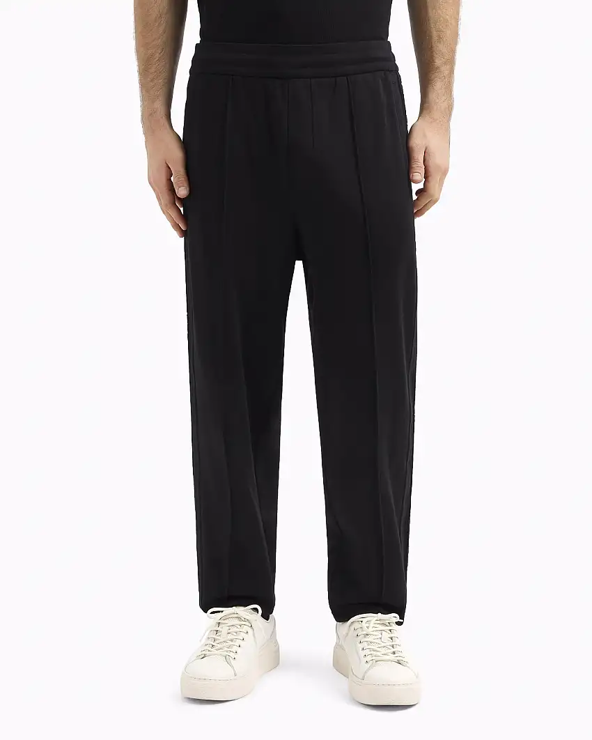 Pantalone nero in interlock di cotone con banda porta logo tono su tono