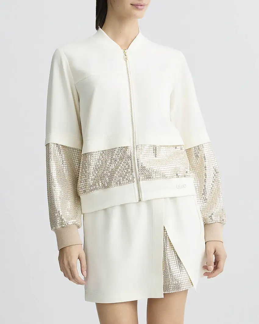 Giacca bomber color avorio in tessuto tecnico con inserti in paillettes dorate su fondo e fondomaniche