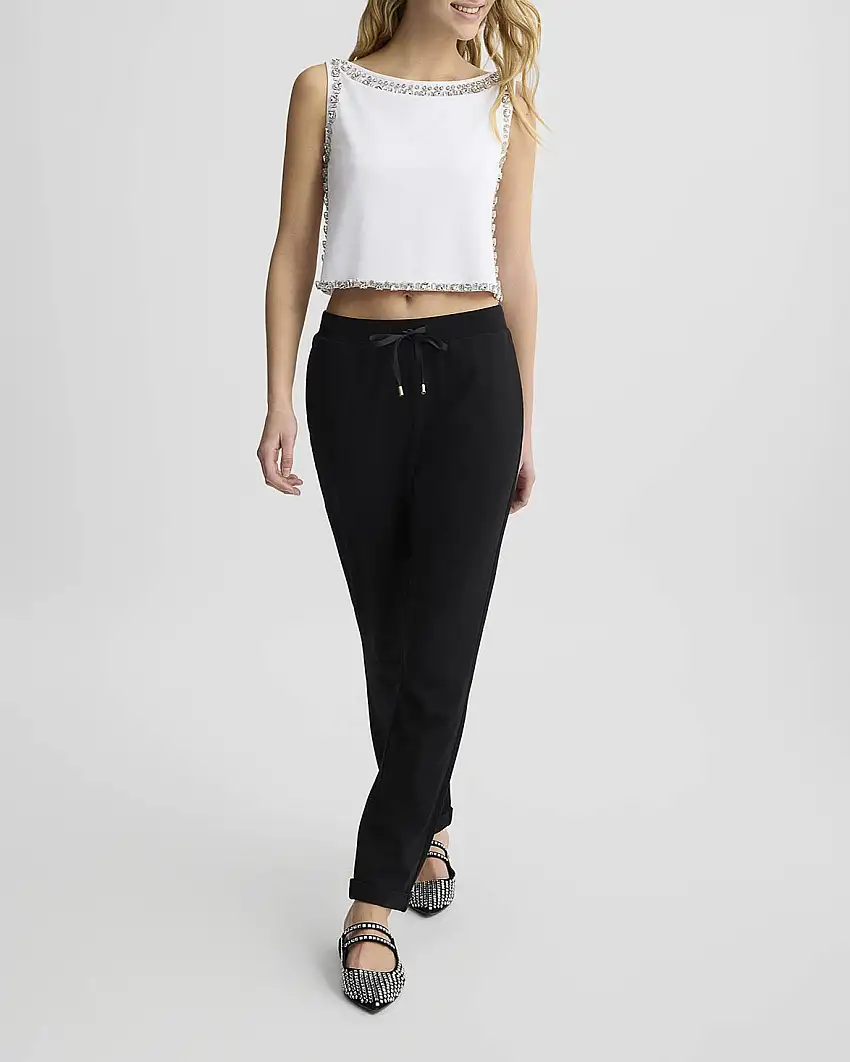 Joggers nero in misto viscosa interlock con tasche america e risvolto al fondo