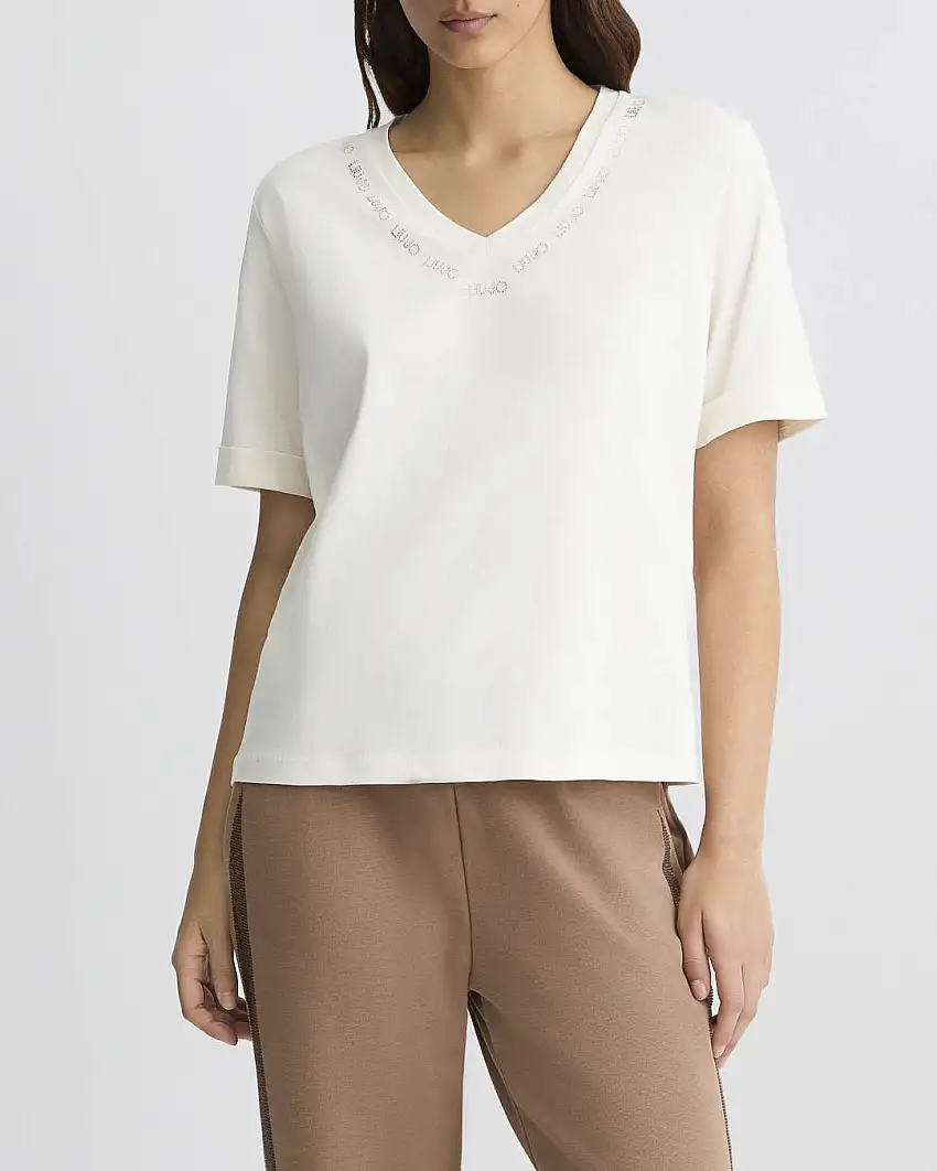 T-shirt bianca in cotone con scritta logo in strass argento lungo lo scollo a V