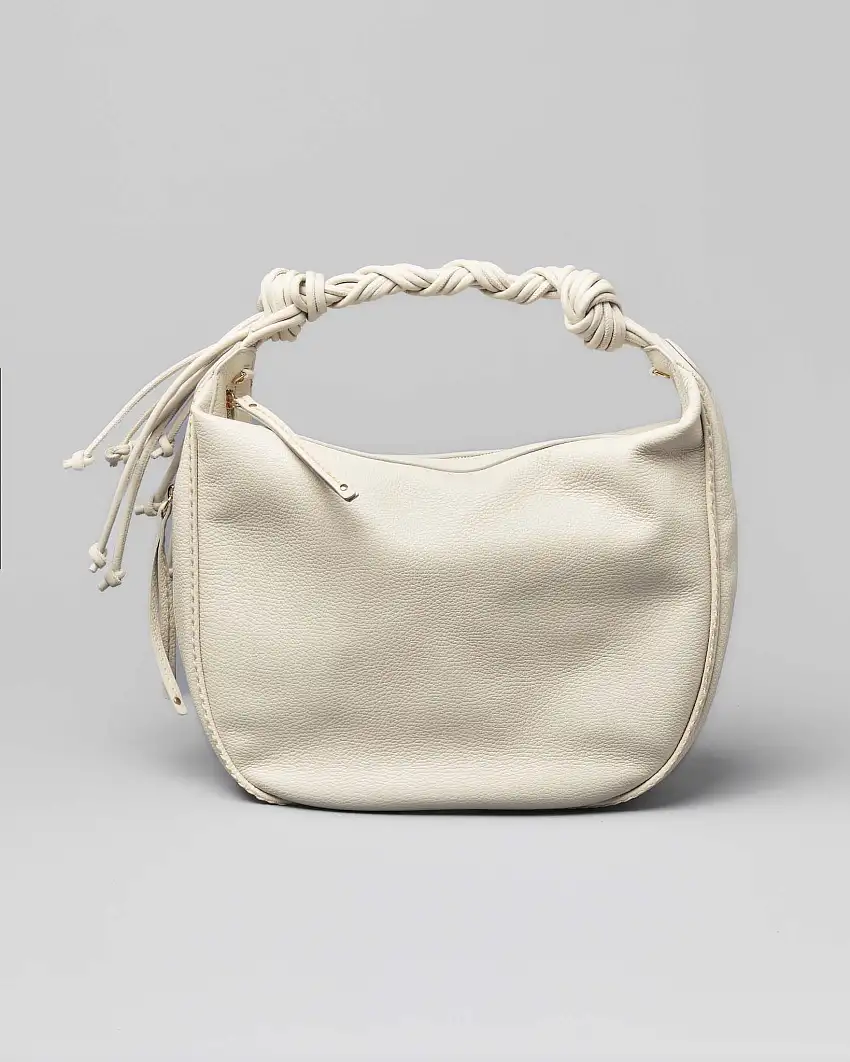 Borsa color latte in pelle martellata a sacca con spallaccio intrecciato