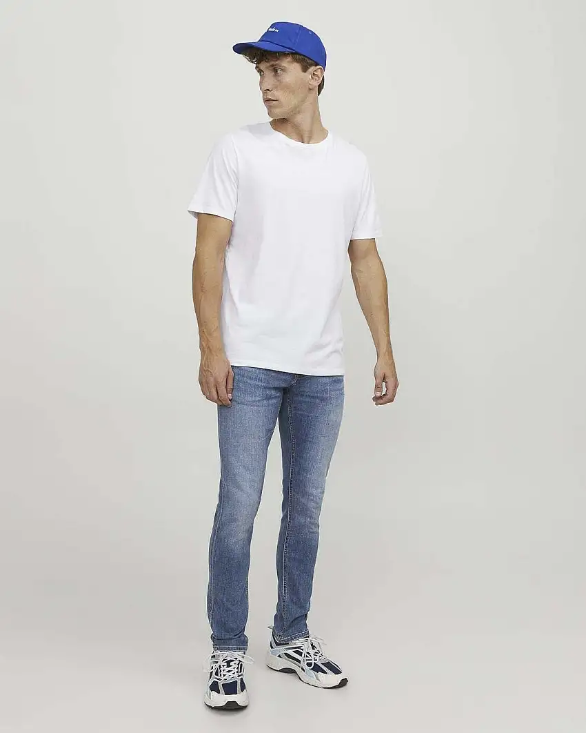 Jeans slim a vita bassa in cotone stretch lavaggio chiaro stone washed con baffature e sabbiature