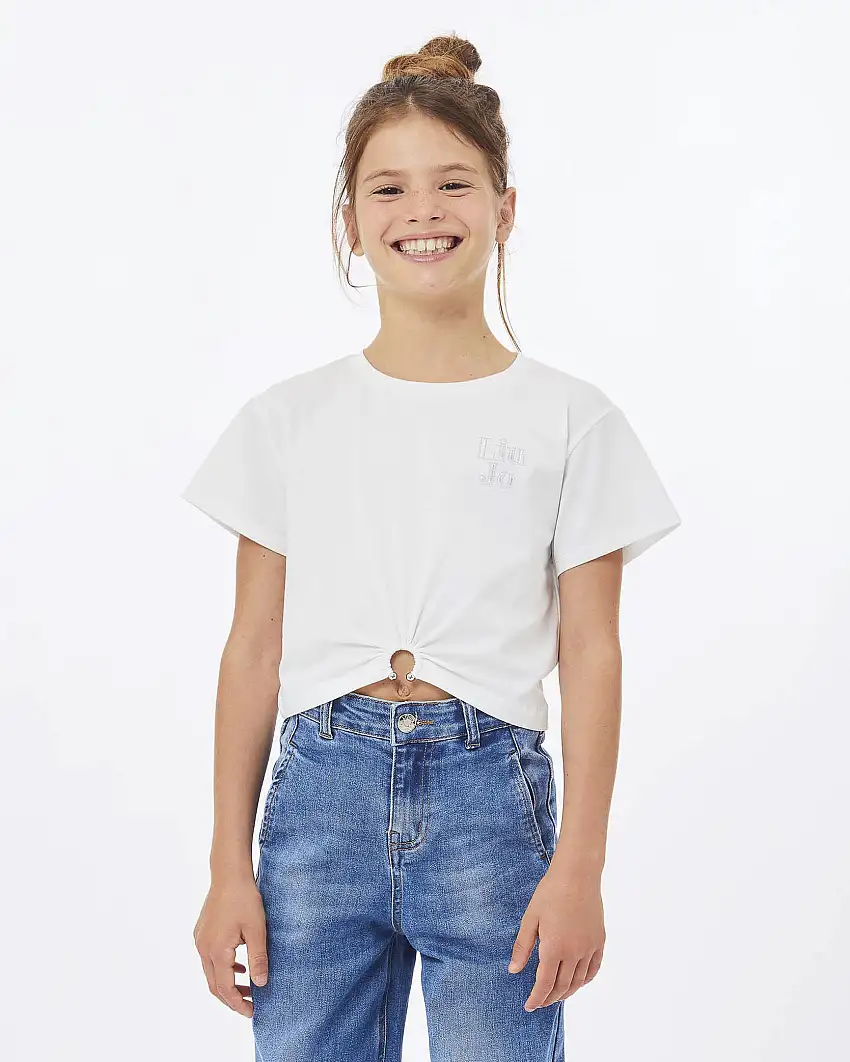 T-shirt cropped bianca con arricciatura e piercing sul fondo