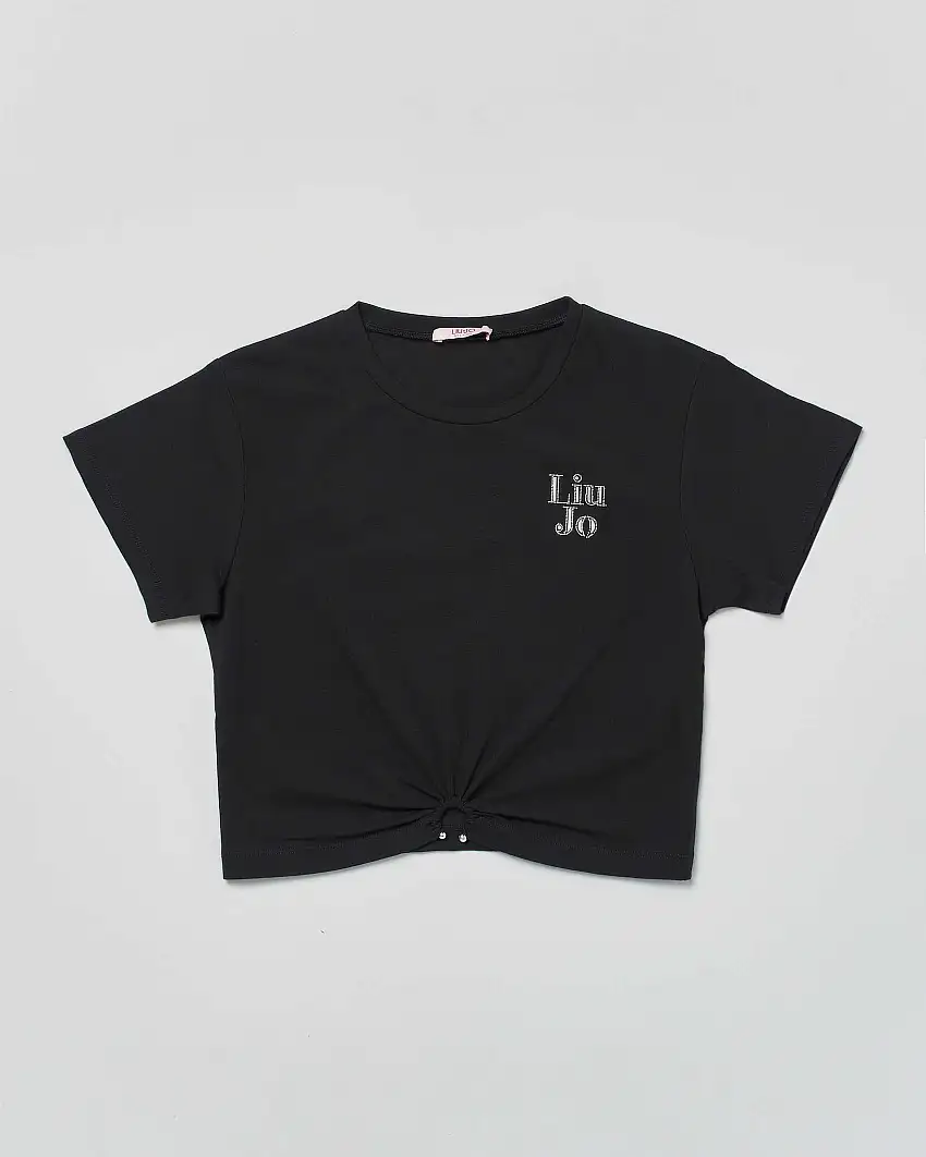 T-shirt cropped nera con arricciatura e piercing sul fondo
