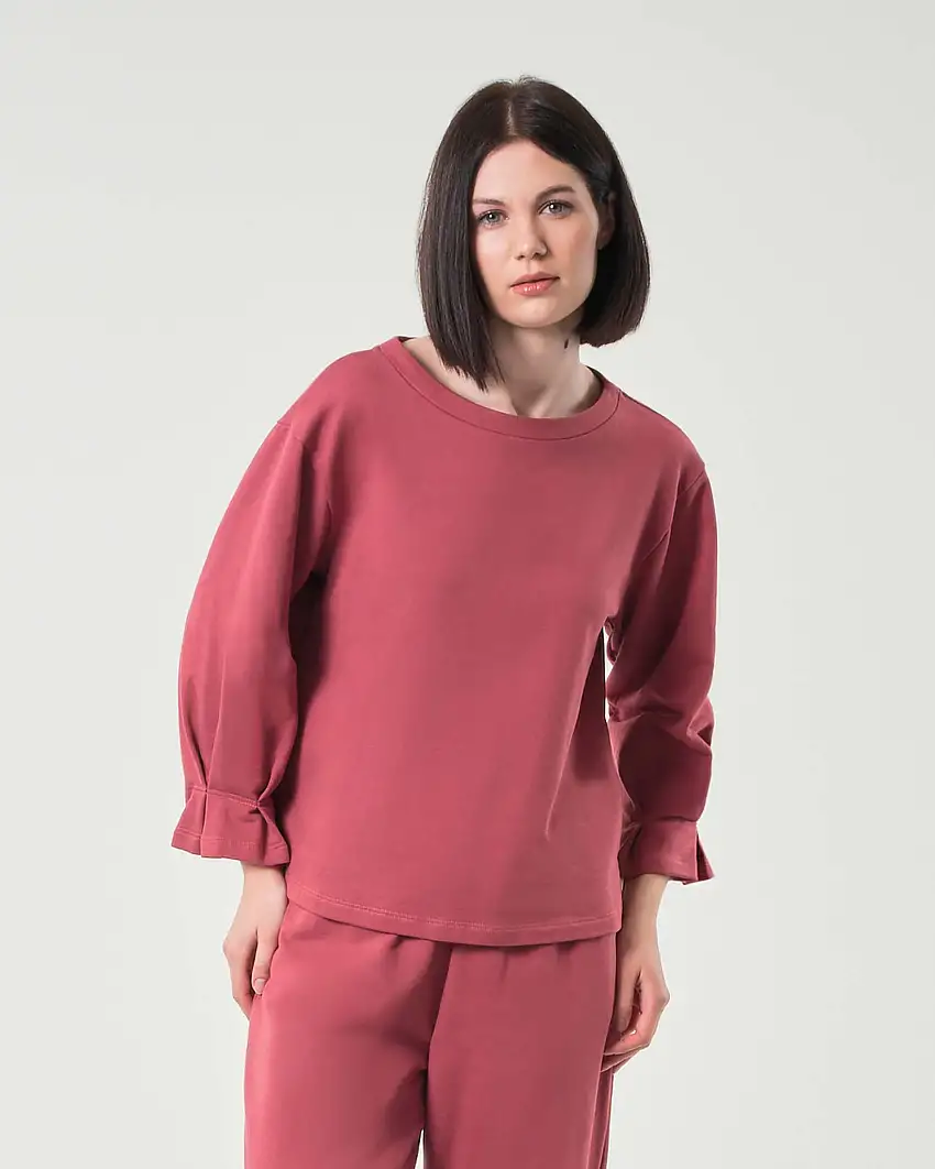 Felpa color ruggine in cotone garzato con cucitura e motivo a pieghe sui polsini