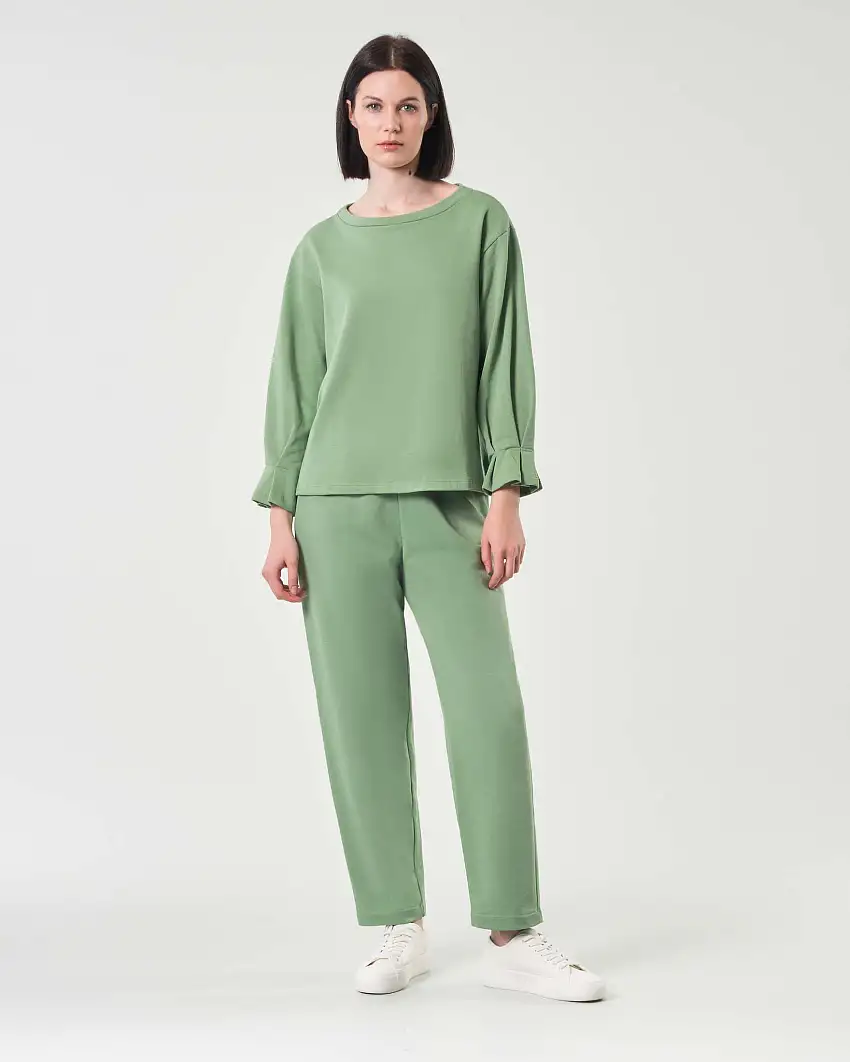 Pantaloni verde chiaro in felpa di cotone garzato dalla linea dritta con elastico in vita
