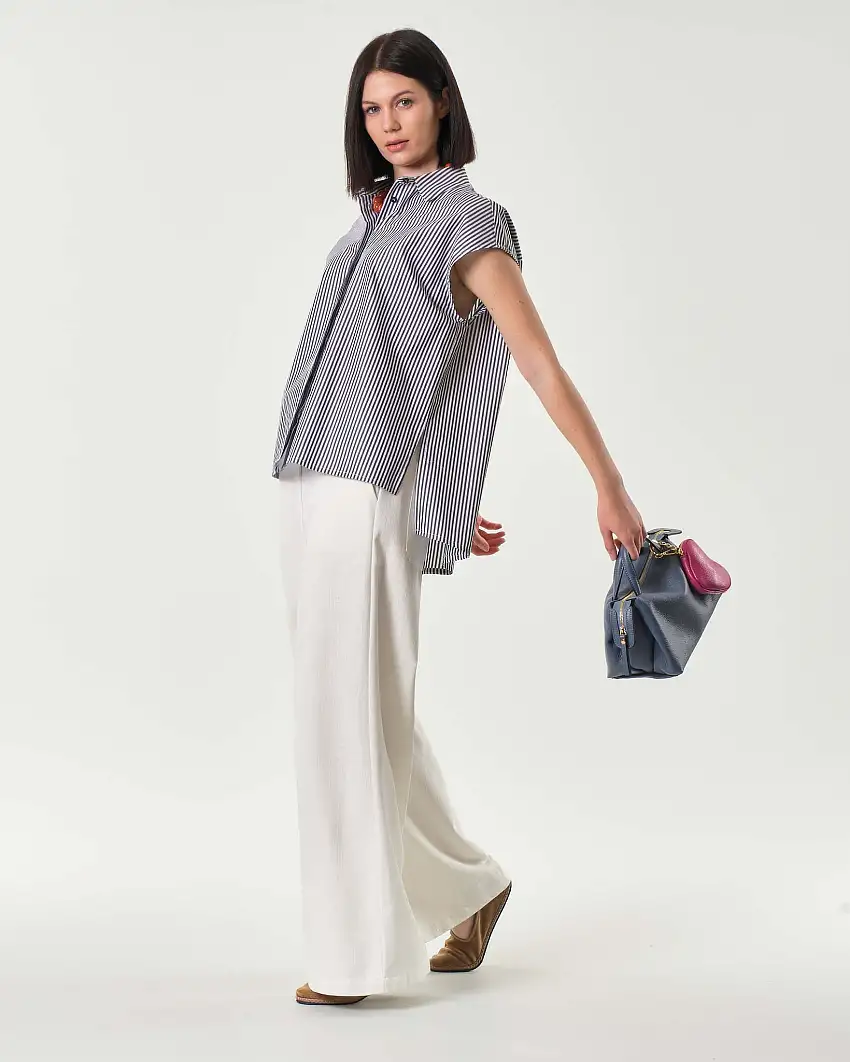 Pantaloni palazzo bianchi in denim di cotone con elastico inserito in vita sul retro