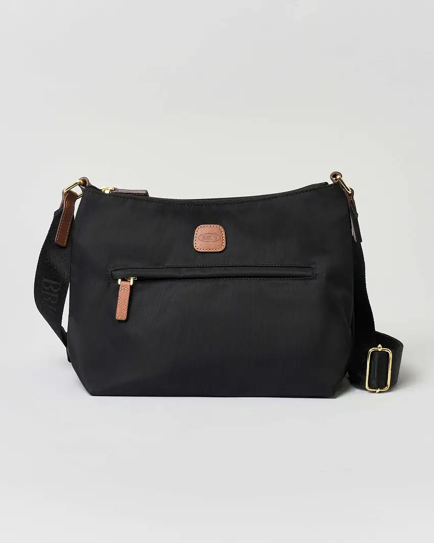 Borsa a tracolla nera Bric's in nylon con tracolla in tessuto regolabile e dettagli in pelle color cuoio